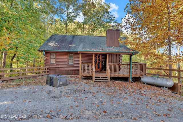 back of house featuring a wooden deck