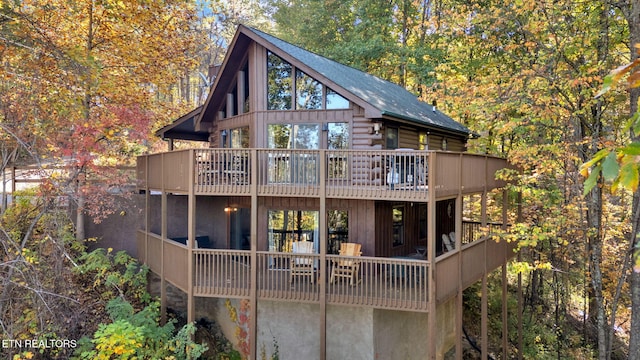 back of house with a wooden deck