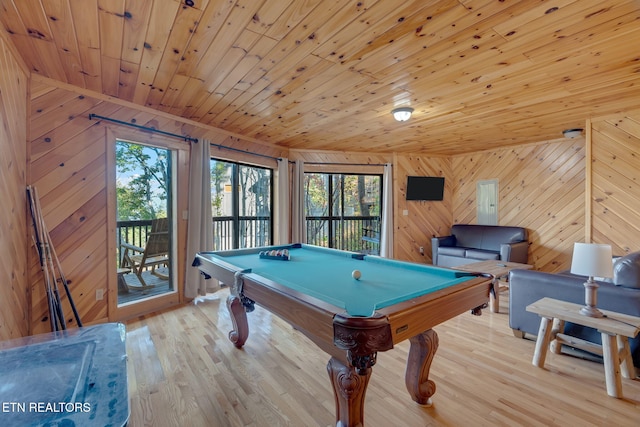 game room featuring wooden ceiling, pool table, light hardwood / wood-style floors, and wood walls