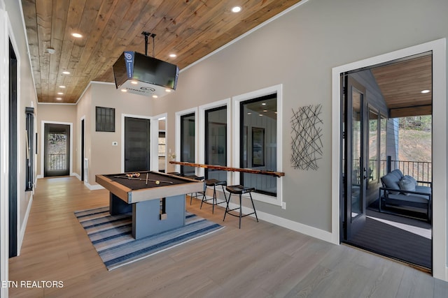 game room featuring wood ceiling, pool table, ornamental molding, and light wood-type flooring