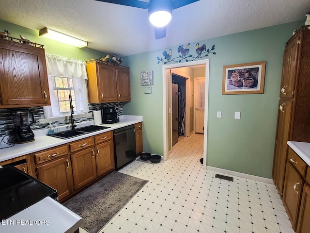 kitchen featuring backsplash, sink, black appliances, a textured ceiling, and ceiling fan