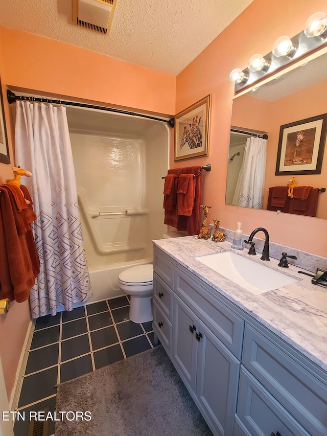 full bathroom featuring shower / tub combo, a textured ceiling, toilet, vanity, and tile patterned flooring