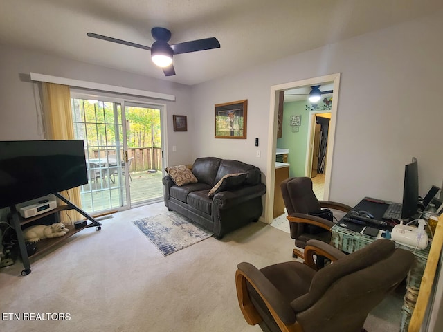 living room featuring light carpet and ceiling fan