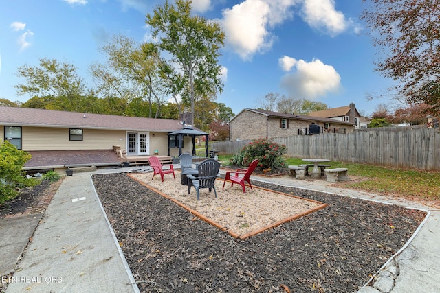 view of yard with an outdoor fire pit and a patio