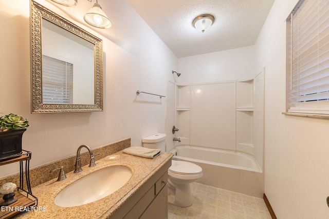 full bathroom featuring vanity, a textured ceiling, toilet, and shower / bathtub combination