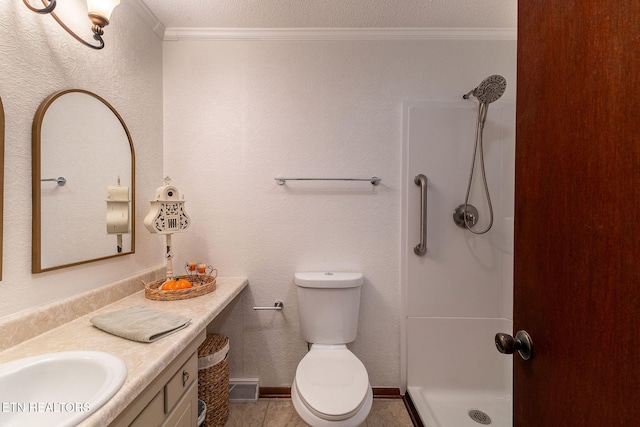 bathroom with ornamental molding, vanity, a textured ceiling, toilet, and a shower