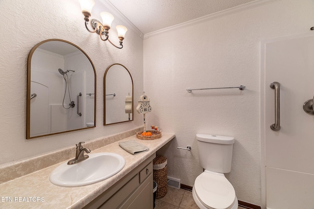 bathroom featuring tile patterned floors, ornamental molding, vanity, a textured ceiling, and toilet