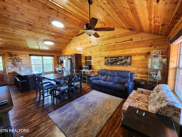 living room with dark hardwood / wood-style floors, wooden walls, wooden ceiling, and ceiling fan