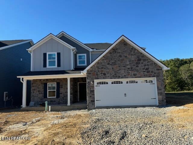 view of front of house with a porch and a garage