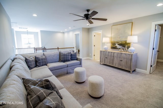 living room with light colored carpet and ceiling fan