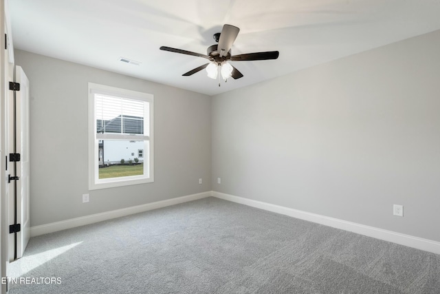 empty room with carpet and ceiling fan