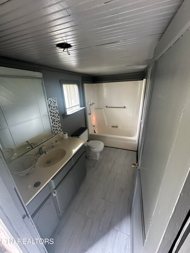 full bathroom with vanity, toilet, and bathing tub / shower combination