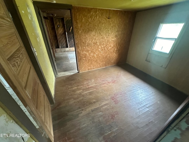 unfurnished room featuring dark hardwood / wood-style flooring