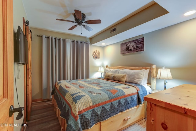 bedroom featuring wood-type flooring and ceiling fan