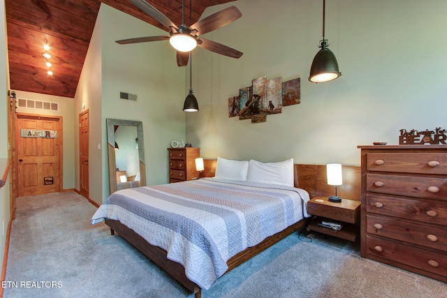 carpeted bedroom featuring wood ceiling, high vaulted ceiling, and ceiling fan