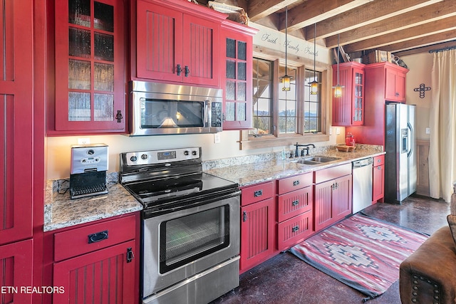 kitchen featuring beam ceiling, hanging light fixtures, sink, appliances with stainless steel finishes, and light stone counters