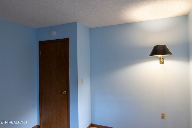 empty room with a textured ceiling