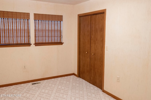 unfurnished bedroom with carpet floors