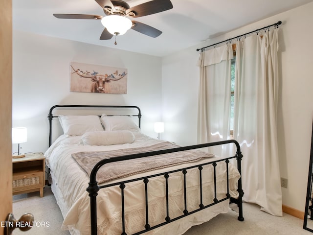 bedroom with light colored carpet and ceiling fan