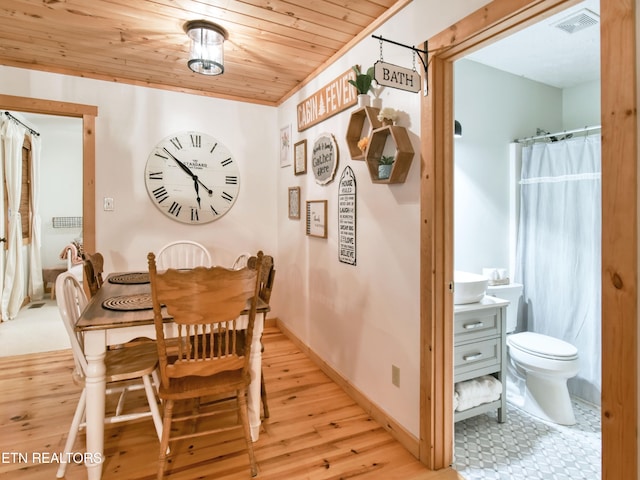 dining area featuring wooden ceiling and light wood-type flooring