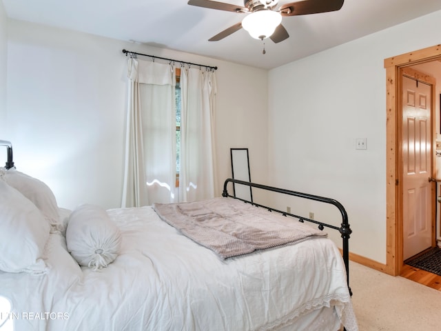 bedroom featuring hardwood / wood-style floors and ceiling fan