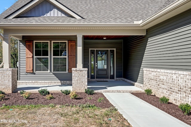 entrance to property featuring a porch