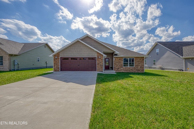 view of front of property featuring a front lawn and a garage