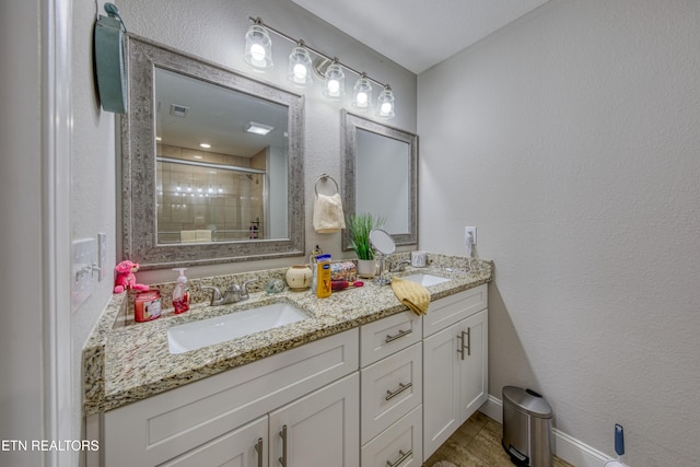 bathroom featuring vanity, hardwood / wood-style flooring, and an enclosed shower