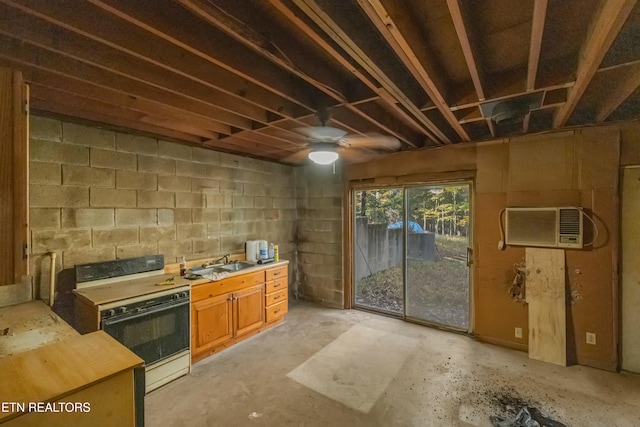 kitchen featuring an AC wall unit, sink, white stove, and ceiling fan