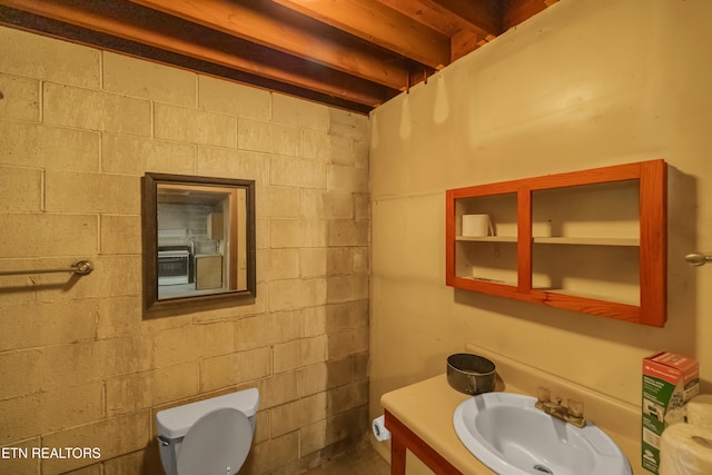 bathroom featuring toilet and vanity