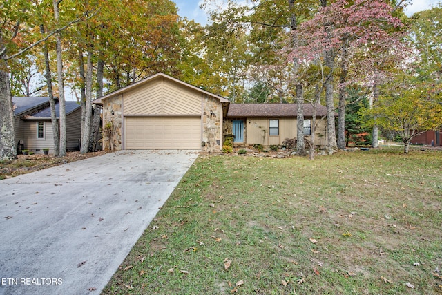 single story home featuring a front yard and a garage