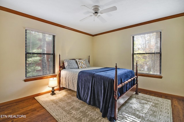 bedroom with ceiling fan, ornamental molding, and dark hardwood / wood-style flooring