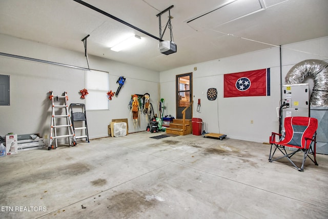 garage with electric panel and a garage door opener