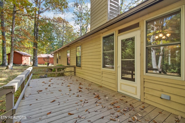 wooden deck with a shed