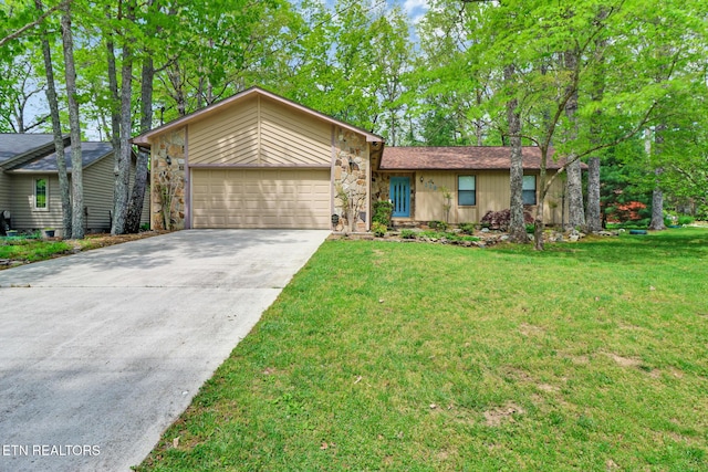 110 Trafalgar Dr, Fairfield Glade, TN 38558 - view of front facade featuring a garage, a front lawn, driveway, and stone siding