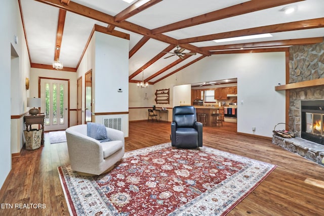110 Trafalgar Dr, Fairfield Glade, TN 38558 - living area featuring ceiling fan, lofted ceiling with beams, a fireplace, wood finished floors, and visible vents