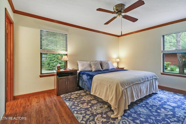 110 Trafalgar Dr, Fairfield Glade, TN 38558 - bedroom with baseboards, ornamental molding, a ceiling fan, and wood finished floors
