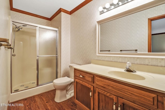 110 Trafalgar Dr, Fairfield Glade, TN 38558 - bathroom featuring crown molding, toilet, a shower stall, and wood finished floors