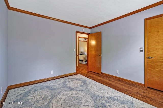 110 Trafalgar Dr, Fairfield Glade, TN 38558 - empty room featuring crown molding, baseboards, and wood finished floors