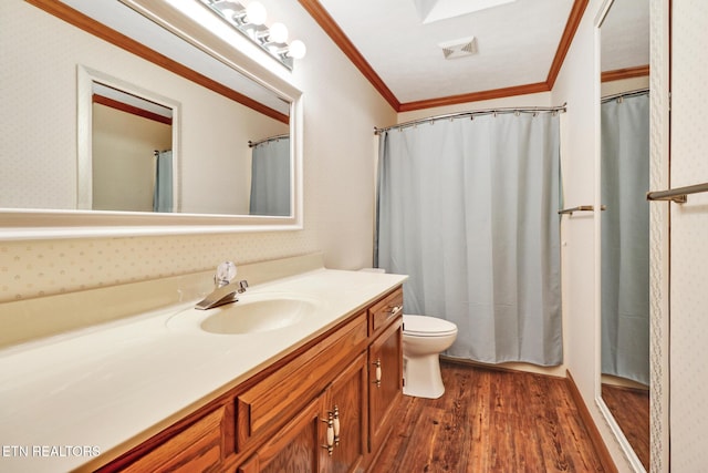 110 Trafalgar Dr, Fairfield Glade, TN 38558 - bathroom with vanity, ornamental molding, visible vents, wood finished floors, and toilet