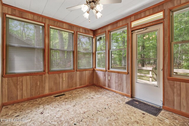 110 Trafalgar Dr, Fairfield Glade, TN 38558 - unfurnished sunroom with a healthy amount of sunlight and baseboards