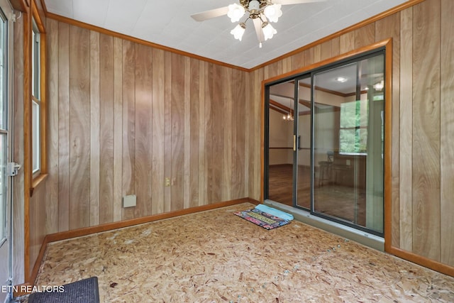 110 Trafalgar Dr, Fairfield Glade, TN 38558 - unfurnished room featuring crown molding, baseboards, a ceiling fan, and wood walls