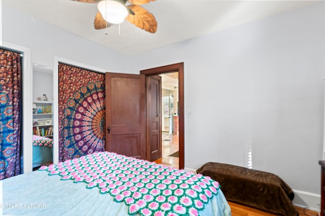 bedroom with light wood-type flooring and ceiling fan