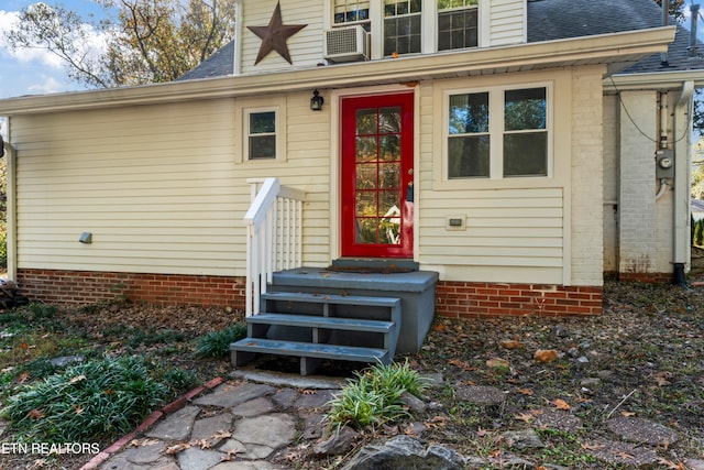 view of exterior entry featuring cooling unit