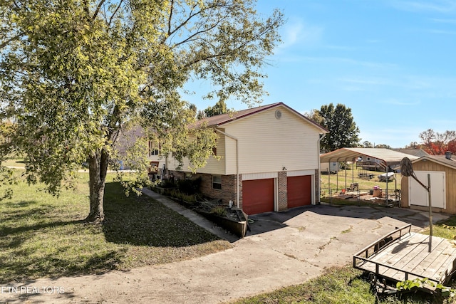 view of home's exterior featuring a yard, a storage unit, and a garage