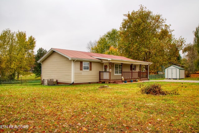 1010 Sheppard Rd, Jamestown, TN 38556 - single story home featuring a shed, an outbuilding, a porch, metal roof, and central AC unit