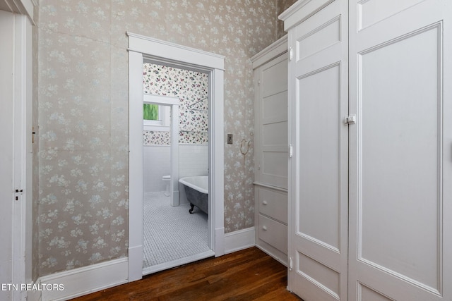 bathroom featuring hardwood / wood-style flooring and a bath