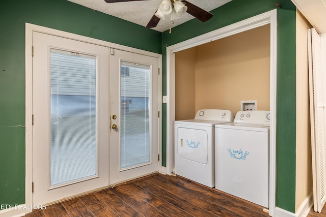 laundry area with a textured ceiling, ceiling fan, washing machine and dryer, and dark hardwood / wood-style flooring