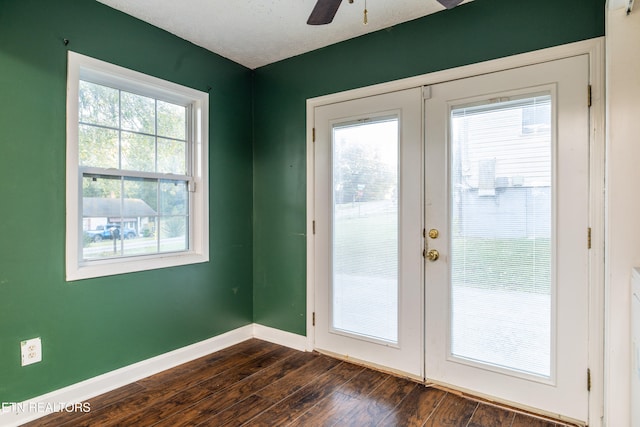 doorway featuring french doors, dark hardwood / wood-style floors, and ceiling fan