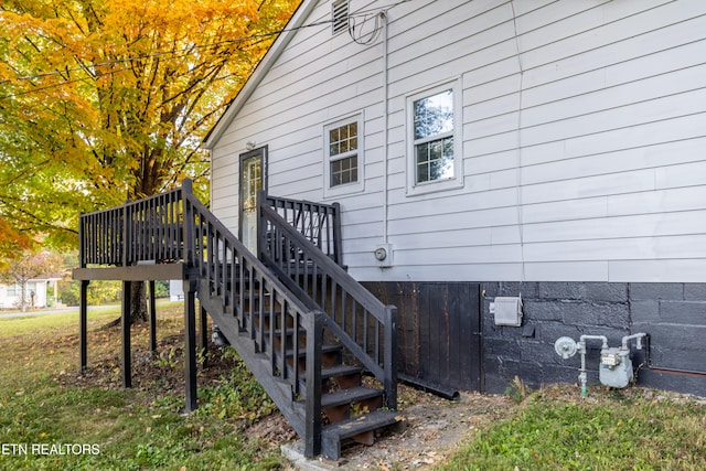 view of side of property with a wooden deck